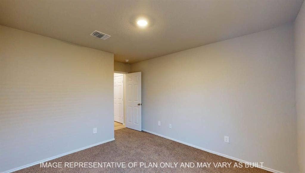 10405 Altair Drive, Waco, TX 76708 Neutral wall paint, plush carpet flooring, recessed lighting, and a white interior door with a round handle