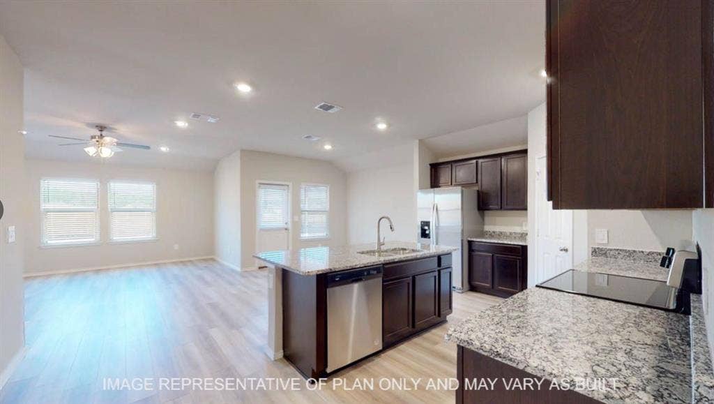10405 Altair Drive, Waco, TX 76708 Open-concept living area with wood-finish flooring, a ceiling fan, and recessed lighting