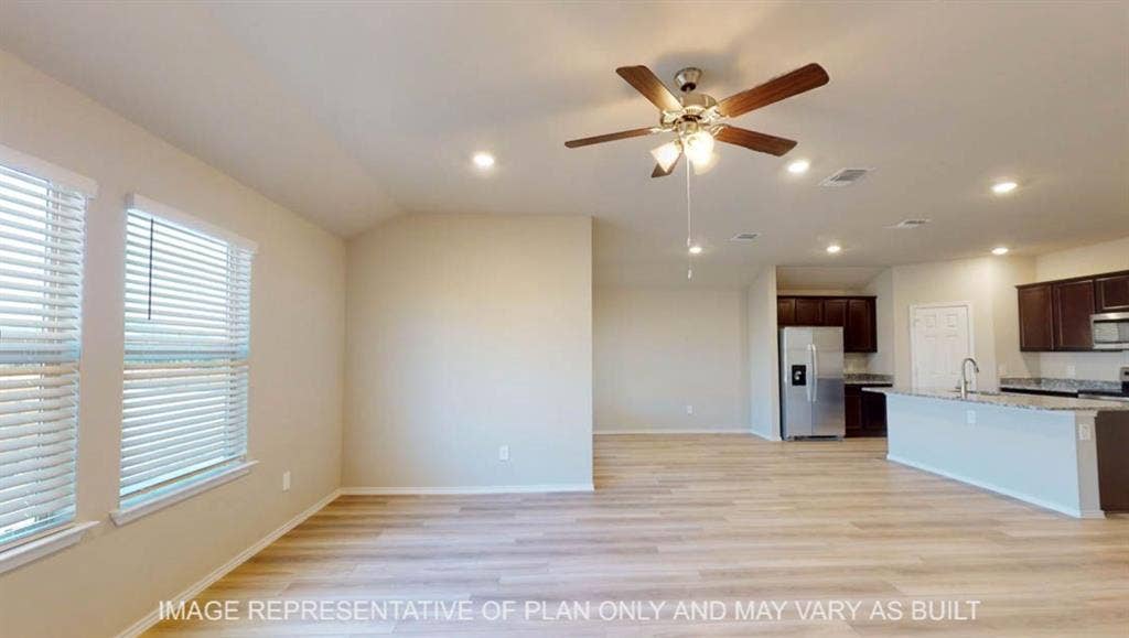 10405 Altair Drive, Waco, TX 76708 Wood-finish flooring throughout, recessed lighting, ceiling fan, and stainless steel appliances