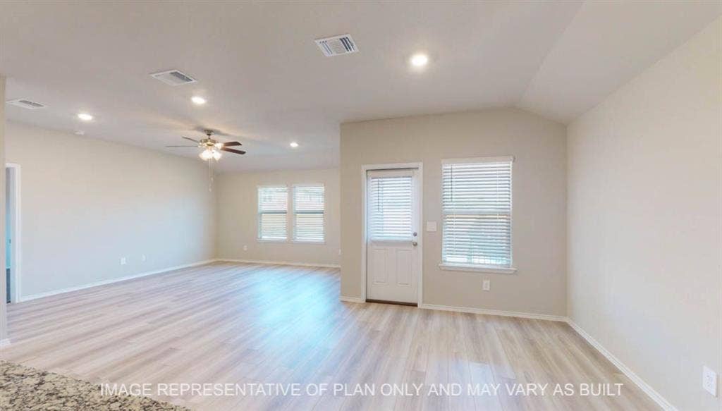 10405 Altair Drive, Waco, TX 76708 Recessed lighting, wood-finish flooring, ceiling fan, vaulted ceiling, and multiple windows with blinds