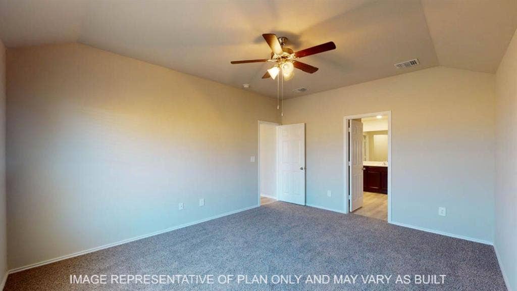 10405 Altair Drive, Waco, TX 76708 Vaulted ceiling, ceiling fan with light fixture, carpeted flooring, and a doorway to a separate room with wood-finish flooring and a dark wood-finish vanity