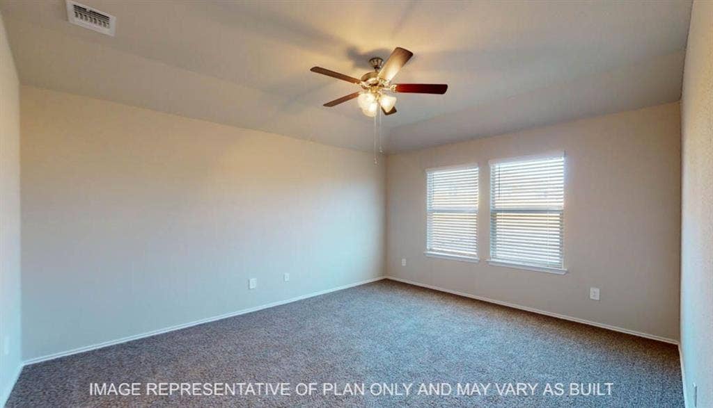 10405 Altair Drive, Waco, TX 76708 Neutral tone wall finishes, carpeting, and a ceiling fan with integrated lighting