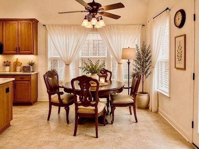 107 Appalachian Way, McKinney, TX 75071 Recessed ceiling light fixture, tile flooring, wood cabinetry with under-cabinet lighting, and multiple windows with blinds