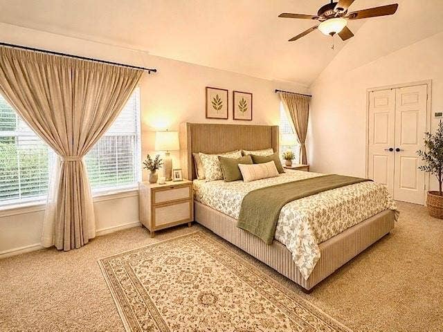 107 Appalachian Way, McKinney, TX 75071 Vaulted ceiling featuring a ceiling fan, carpet flooring, windows with blinds and drapes, and paneled double doors