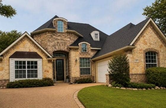 107 Appalachian Way, McKinney, TX 75071 Stone and brick exterior with a dark shingle roof