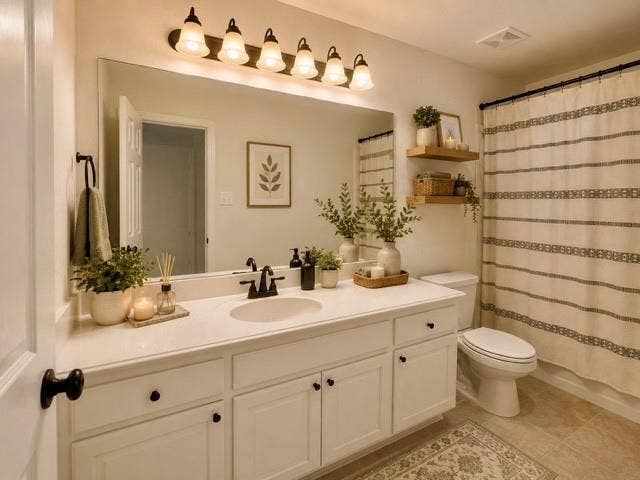 107 Appalachian Way, McKinney, TX 75071 Spa-inspired primary bathroom featuring a generous white vanity with dual sinks, ample storage with multiple drawers and cabinets, and a quartz countertop