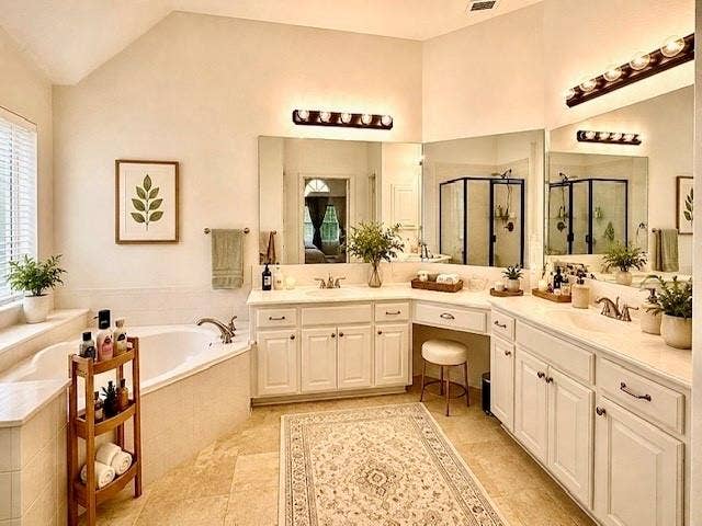 107 Appalachian Way, McKinney, TX 75071 Vaulted ceiling, corner soaking tub, dual vanities with integrated sinks, built-in vanity area, and a glass-enclosed shower