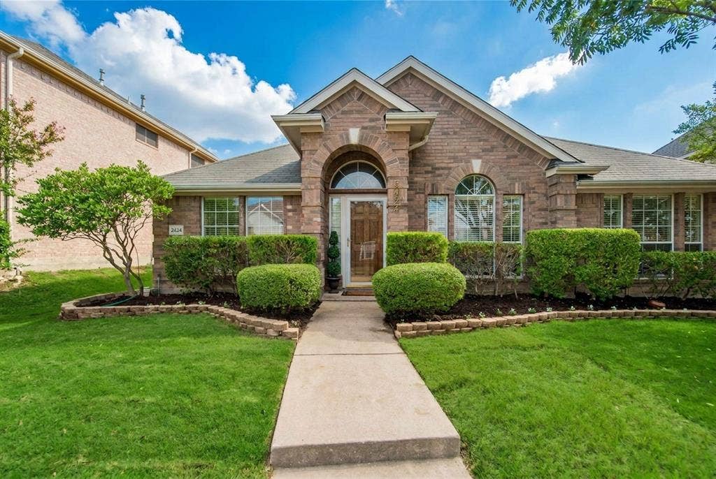 2424 Brycewood Lane, Plano, TX 75025 Brick exterior with arched entry and transom window