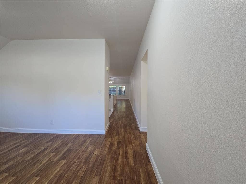 2424 Brycewood Lane, Plano, TX 75025 Wood-finish flooring throughout, bright white walls, and a recessed ceiling