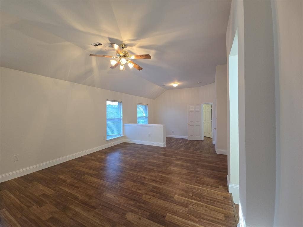 2424 Brycewood Lane, Plano, TX 75025 Vaulted ceiling with a ceiling fan, wood-finish flooring, multiple windows, and recessed lighting