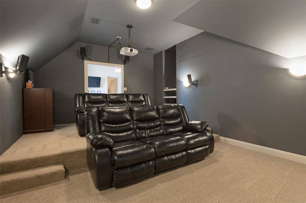 1504 Daisy Lane, Flower Mound, TX 75028 Dedicated media room with tiered carpeted flooring