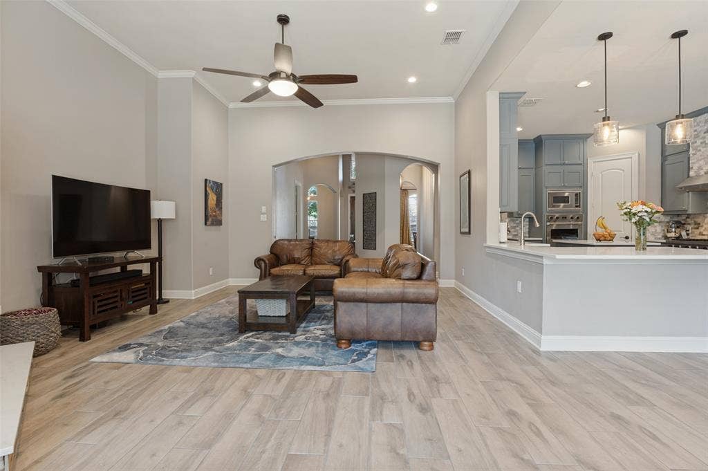1504 Daisy Lane, Flower Mound, TX 75028 Spacious living area featuring wood-finish flooring, recessed lighting, and a ceiling fan