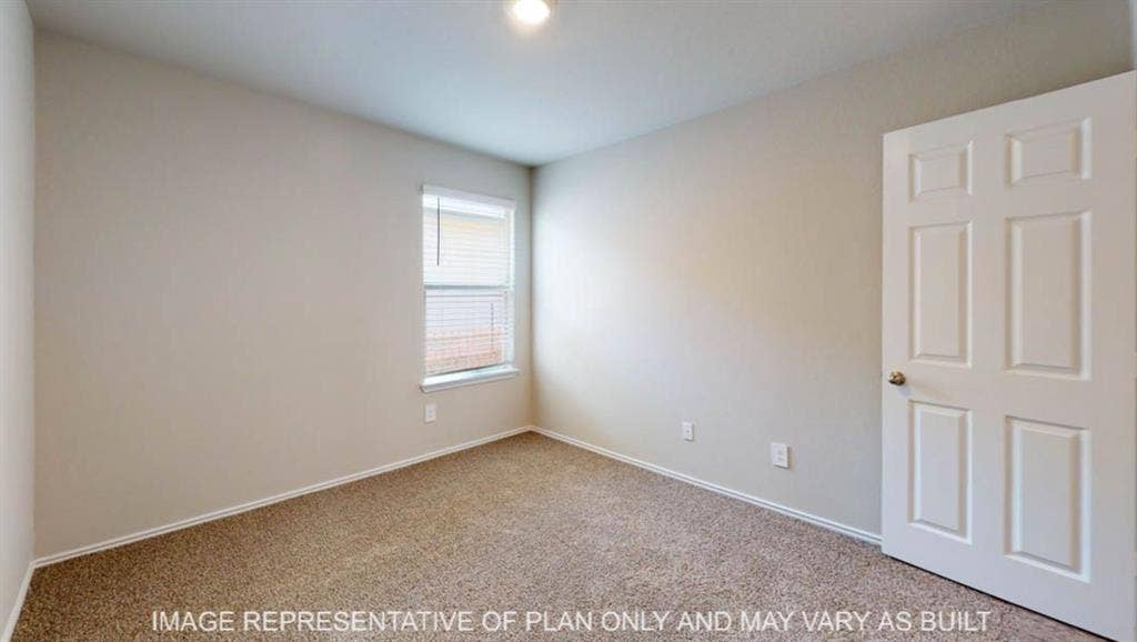 10112 Altair Drive, Waco, TX 76708 Neutral tone wall paint, carpeted flooring, single window with blinds, and a paneled door