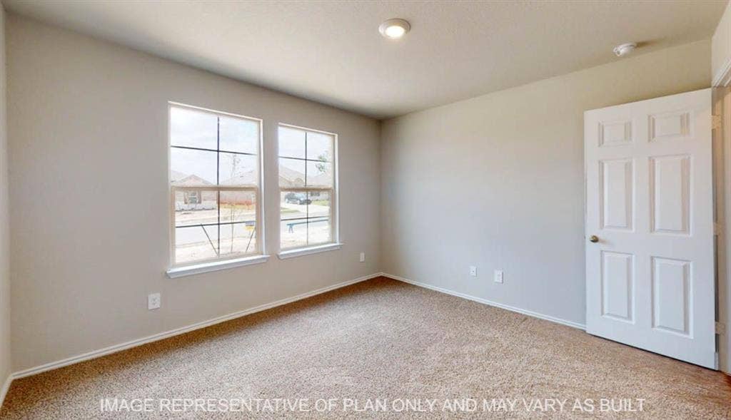 10112 Altair Drive, Waco, TX 76708 Neutral wall paint, plush carpet flooring, two windows, recessed lighting, and a paneled door