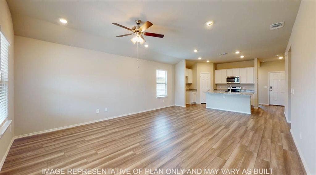 10112 Altair Drive, Waco, TX 76708 Open-concept living area featuring wood-finish flooring, recessed lighting, and a ceiling fan