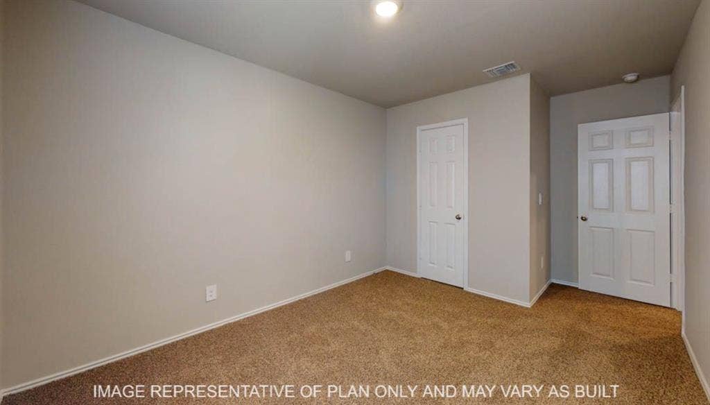 10112 Altair Drive, Waco, TX 76708 Carpeted flooring with light-toned walls, white trim, and a ceiling-mounted light fixture