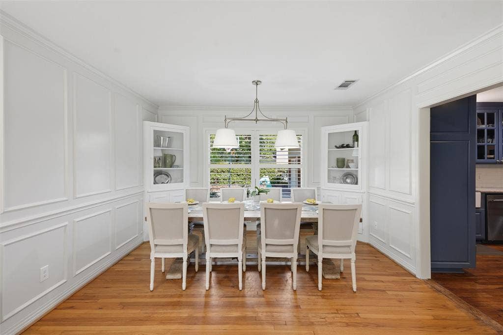 3712 Brighton Road, Fort Worth, TX 76109 Formal dining area highlighting the timeless wainscoting, built in corner hutches, and great natural light.