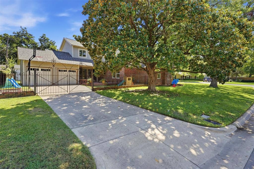 3712 Brighton Road, Fort Worth, TX 76109 Wide view of the corner lot featuring mature trees providing large shade for evening family time.