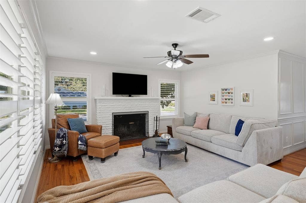 3712 Brighton Road, Fort Worth, TX 76109 Living room featuring beautiful white fireplace perfect for family gatherings.