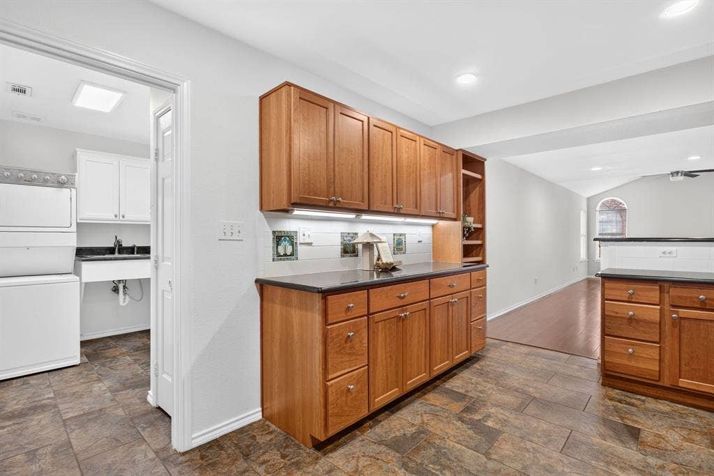 Laundry room connects kitchen to garage.