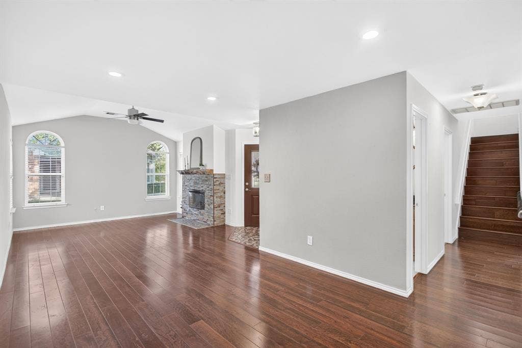 Interior is neutral and in excellent condition - powder bathroom is first door in hallway; guest and primary bedroom just beyond on either side.