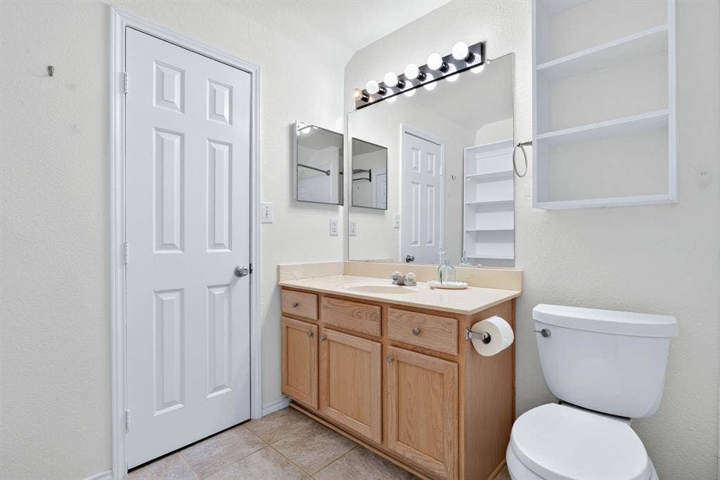 Upstairs full bathroom boasts a ton of storage, a big walk-in closet and extra shelving.