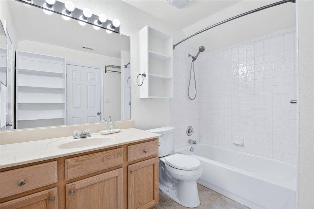 Nice-sized vanity and big tub-shower combo.