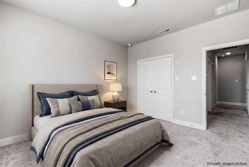 Neutral wall palette, soft carpeting, recessed lighting, and white paneled doors