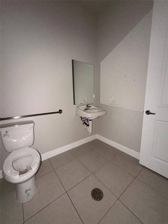3721 S Stonebridge Drive, #704, McKinney, TX 75070 Wall-mounted sink with chrome faucet, a mirror, and a toilet