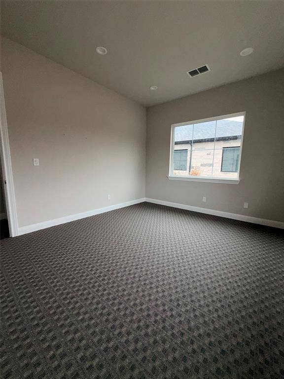 3721 S Stonebridge Drive, #704, McKinney, TX 75070 Recessed lighting, patterned carpet flooring, and a large window