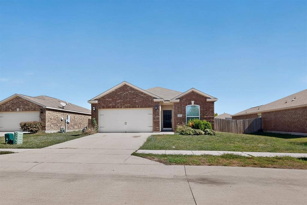215 Magnolia Drive, Princeton, TX 75407 Brick exterior with a gabled roofline
