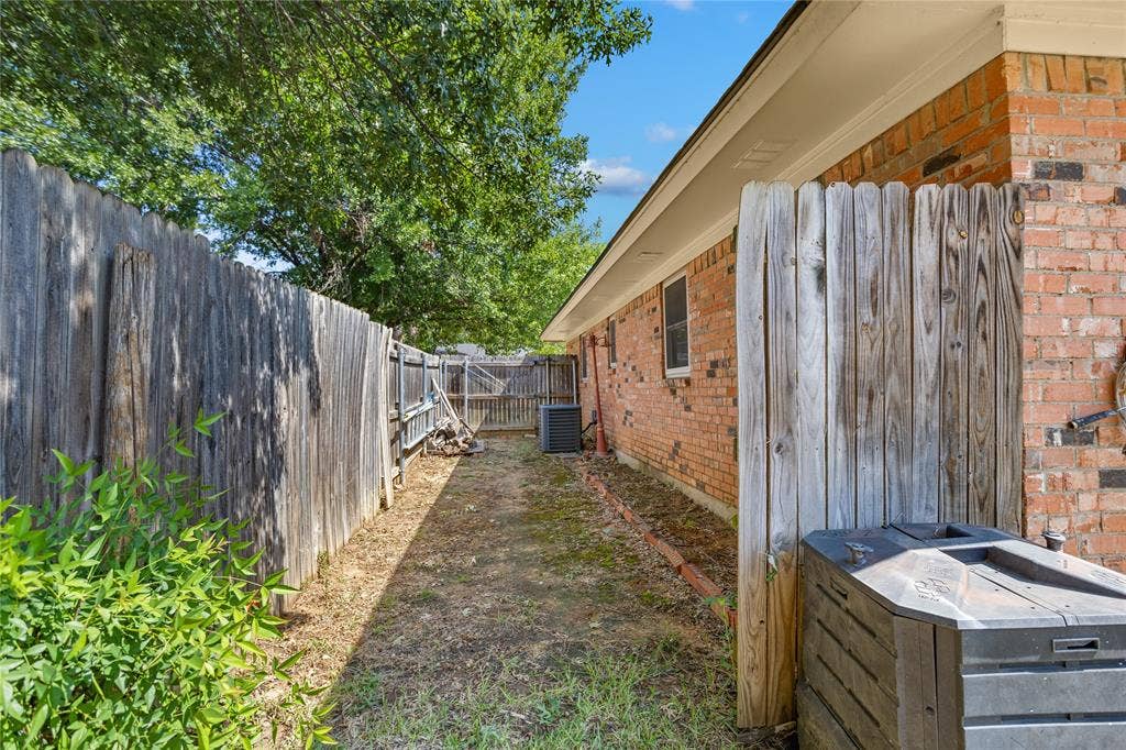 2004 Ford Street, Arlington, TX 76013 Brick exterior with wood fencing