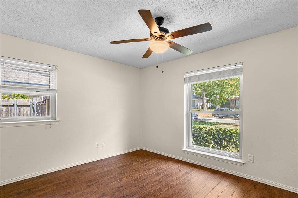 2004 Ford Street, Arlington, TX 76013 Wood-finish flooring with a ceiling fan light fixture