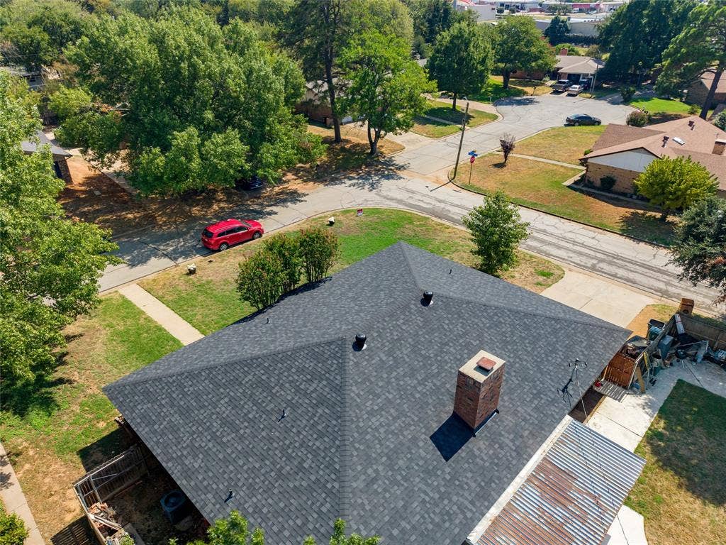 2004 Ford Street, Arlington, TX 76013 Asphalt shingle roof with a brick chimney