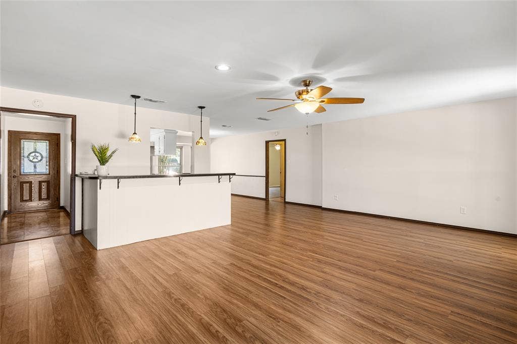 2004 Ford Street, Arlington, TX 76013 Open concept living area featuring wood-finish flooring, recessed lighting, and a ceiling fan