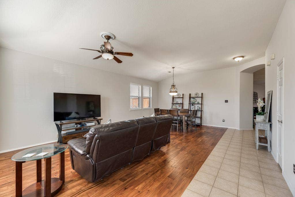 1323 Canyon Creek Road, Wylie, TX 75098 Open-concept living space featuring wood-finish flooring, a ceiling fan, and recessed lighting