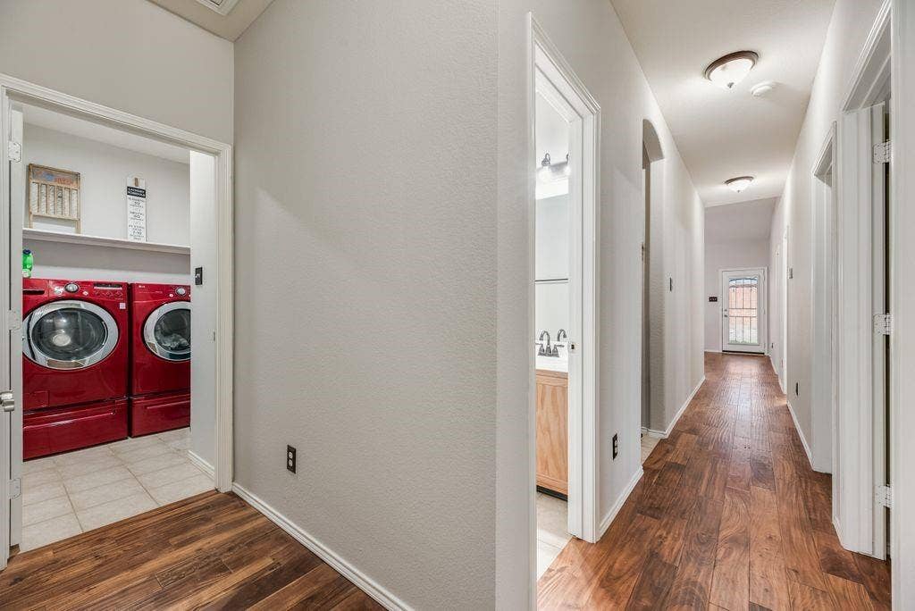1323 Canyon Creek Road, Wylie, TX 75098 Hallway with wood-finish flooring, recessed lighting, and white trim