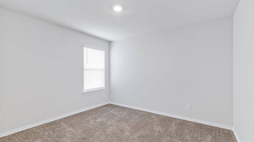 5012 Shumard Drive, Lindale, TX 75771 Recessed ceiling lighting, textured wall finish, window with horizontal blinds, and carpeted flooring