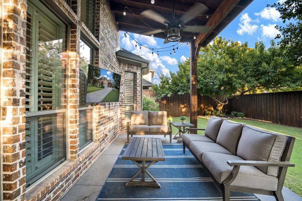 lovely patio with mature trees and zoysia gass