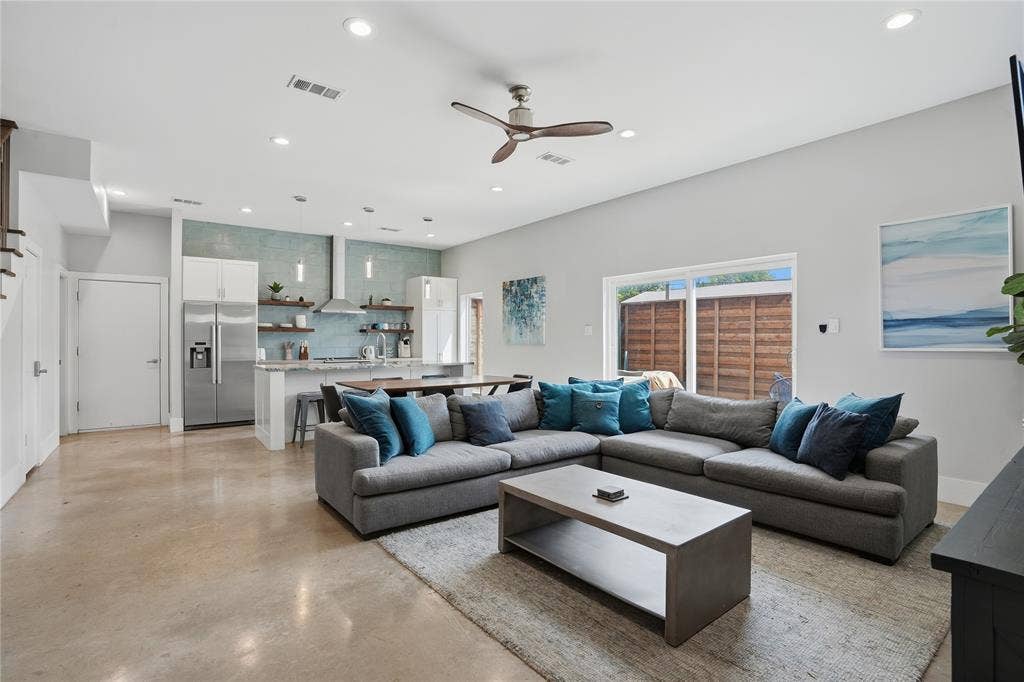 180 S Cisco Street, Dallas, TX 75246 Open living and kitchen areas with concrete flooring