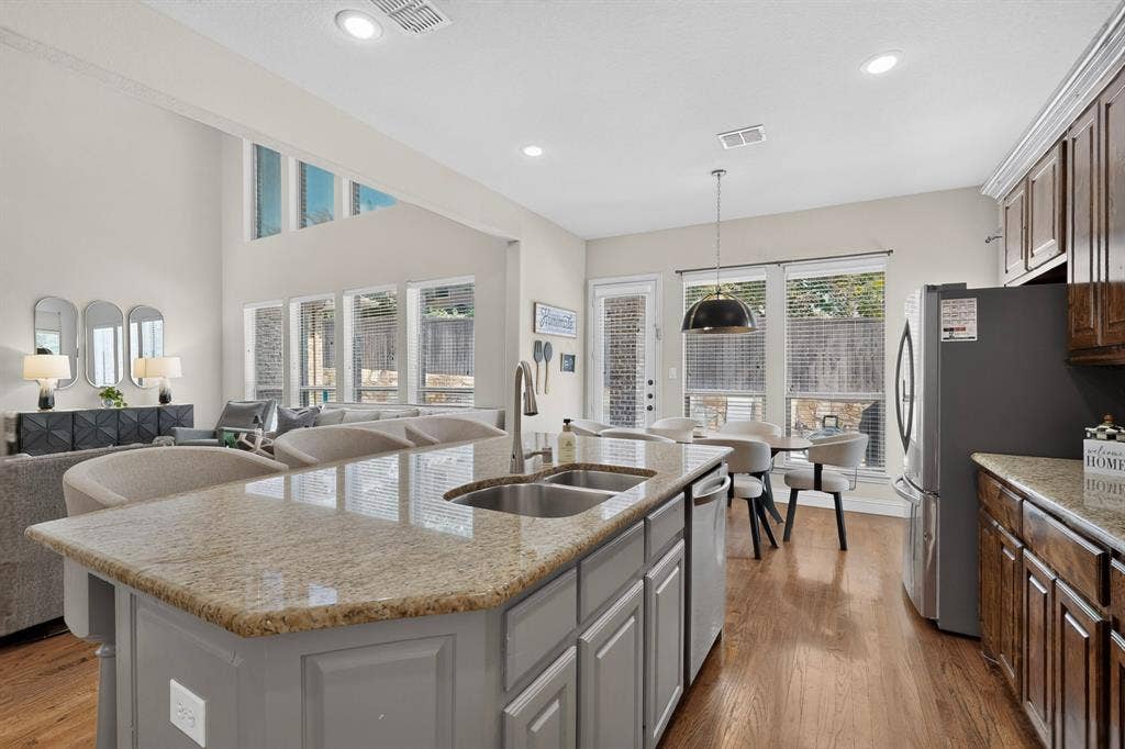 1494 Willingham Drive, Allen, TX 75013 Kitchen island with an undermount double-basin sink and a granite-finish countertop