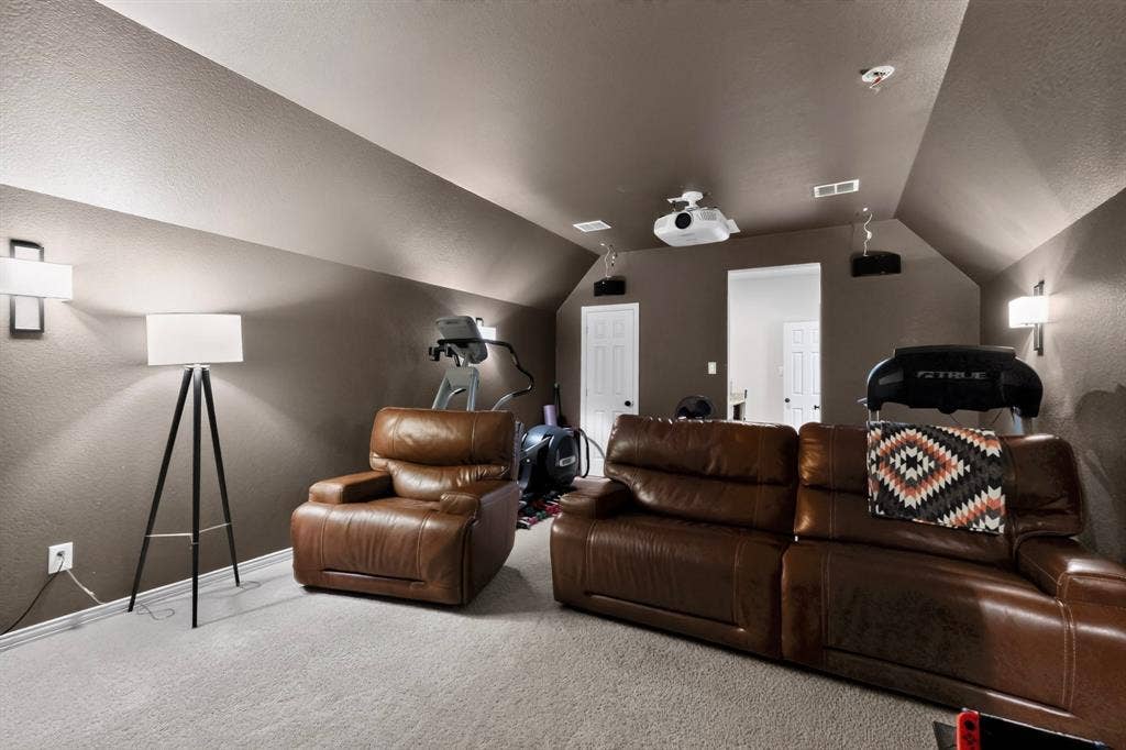 1494 Willingham Drive, Allen, TX 75013 Carpeted room with sloped ceilings, recessed lighting, and wall-mounted sconces