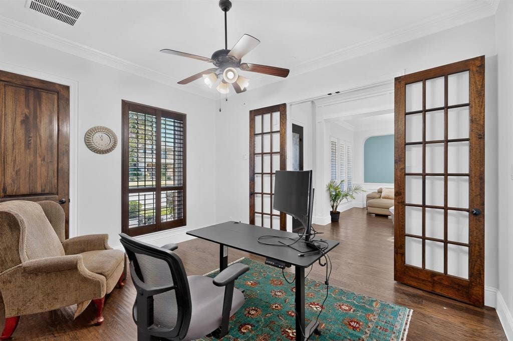 13853 Myatt Avenue, Frisco, TX 75035 Room featuring a ceiling fan with integrated lighting, wood-finish flooring, and white crown molding