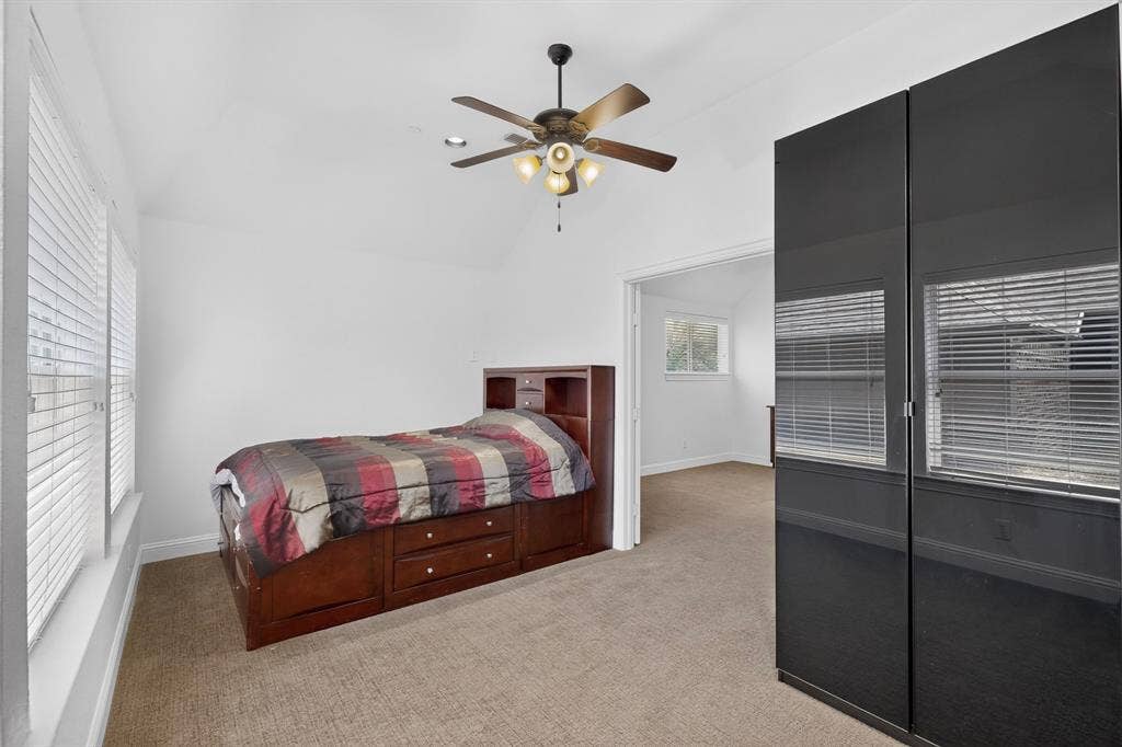 13853 Myatt Avenue, Frisco, TX 75035 Bright interior room featuring a vaulted ceiling and a ceiling fan with integrated lighting