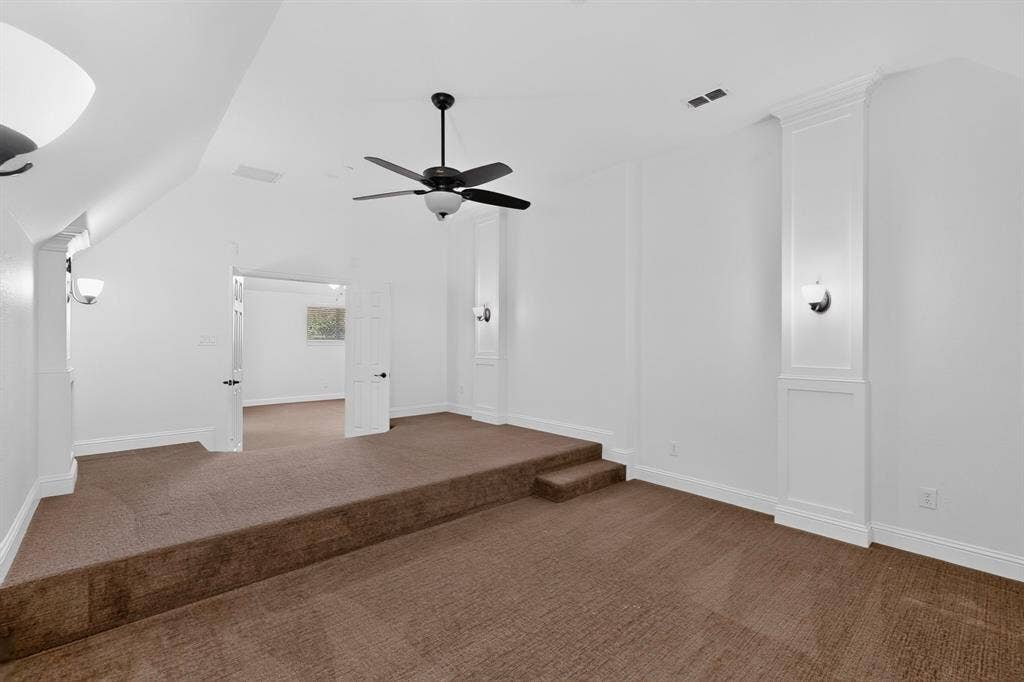 13853 Myatt Avenue, Frisco, TX 75035 Carpeted multi-level room featuring a ceiling fan, wall sconces, and white trim molding