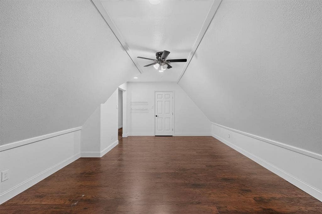 13853 Myatt Avenue, Frisco, TX 75035 Spacious bonus room featuring wood-finish flooring, vaulted ceilings, and a ceiling fan with integrated lighting