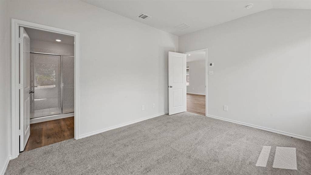 1667 Blaire Drive, Tyler, TX 75702 Spacious room featuring light gray carpeting and white painted walls