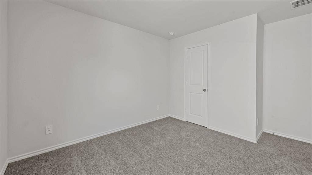 1667 Blaire Drive, Tyler, TX 75702 Neutral-toned wall paint throughout, complemented by light gray carpeting