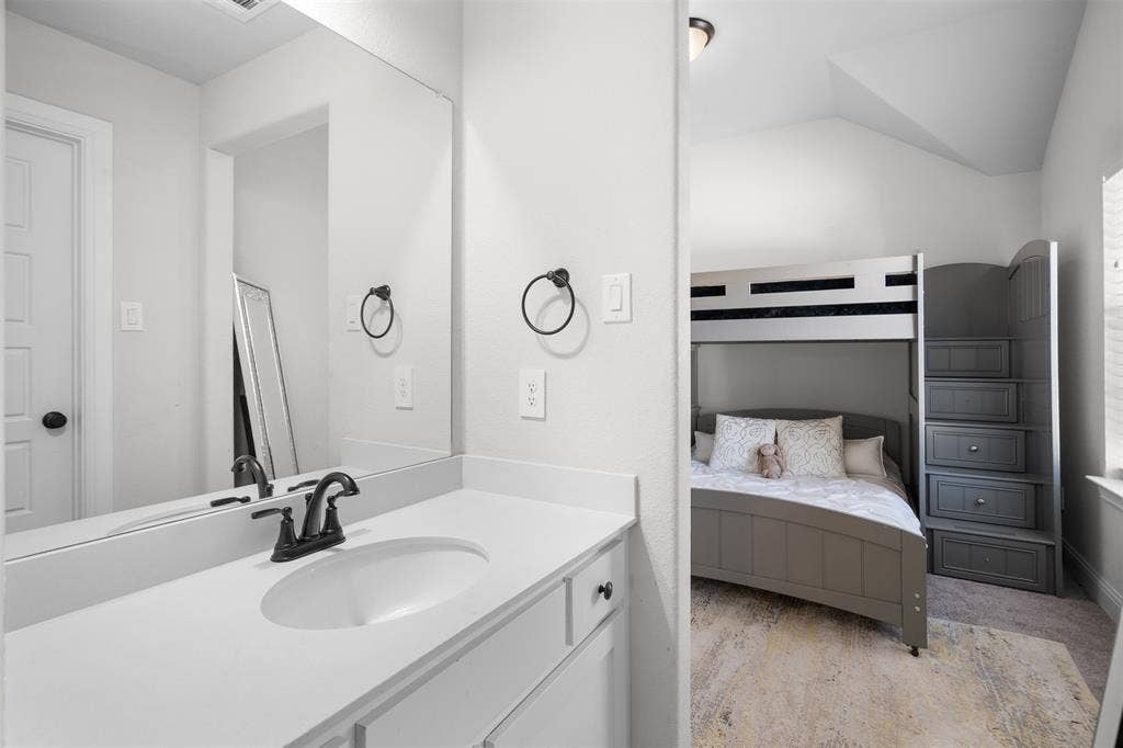 Vanity with integrated sink and matte black faucet
