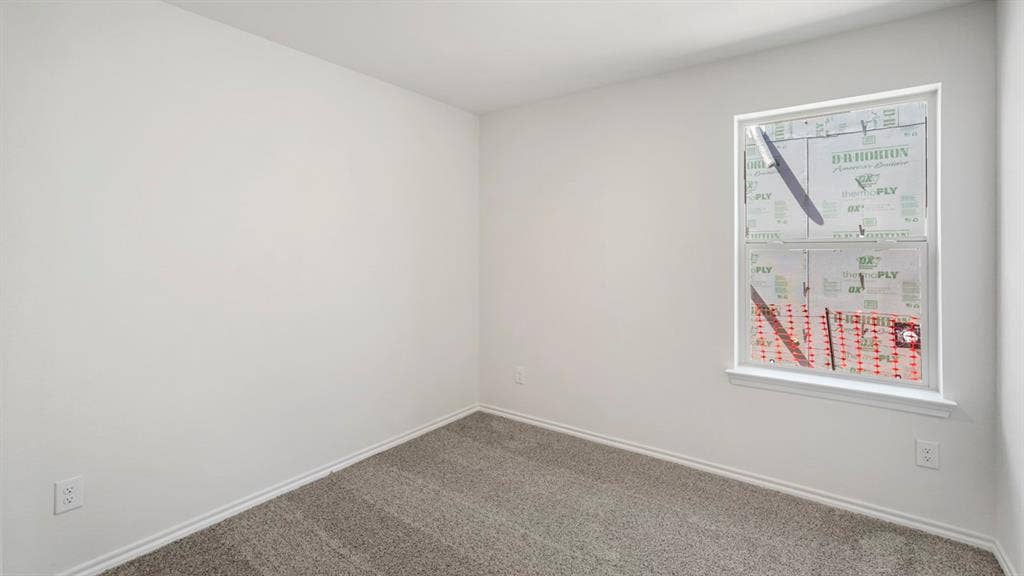 Neutral-toned carpeting and white walls create a versatile interior space
